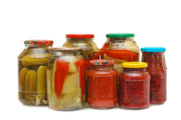 Glass jars with tinned vegetables isolated