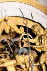 Detail of gold historic clock, clockwork