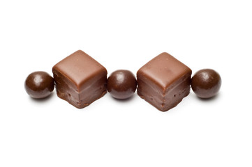 Lined chocolate balls and cubes top view