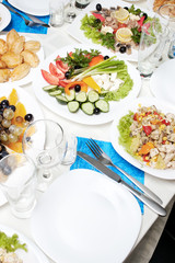 Table appointment with appetizers and selective focus