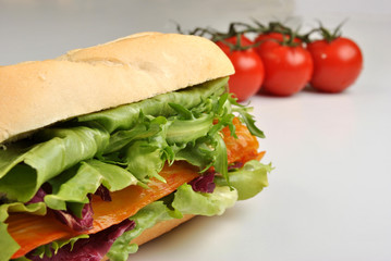 bread roll with organic smoked salmon and tomato