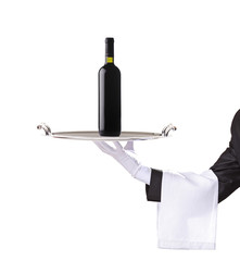Waiter holding a silver tray with a red wine on it