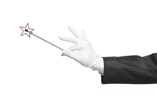 Holding a magic wand isolated on white background