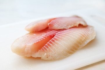 Fillet of fish on a kitchen board