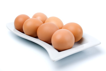 Brown chicken eggs isolated on white