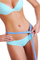 Woman measures a waist