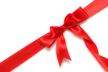 red gift ribbon and bow isolated over white