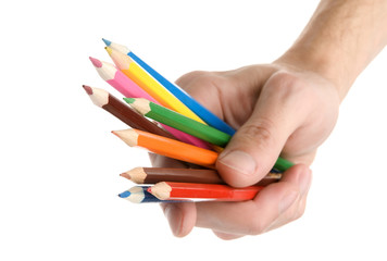 Naklejka premium Pencils in a hand isolated on a white background