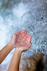 female hands and water like ice