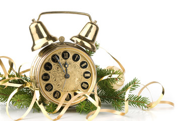 New Year concept. Alarm clock and fir-tree branch