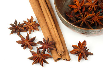 star anise,cinnamon stick and a bowl