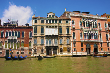 Fototapeta na wymiar Four Gondolas by Buildings in Venice
