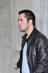 Young man on a concrete background