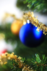 christmas ornament hanging from a xmas tree branch