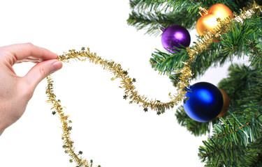 hand decorating christmas tree