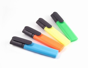 colored markers on white background