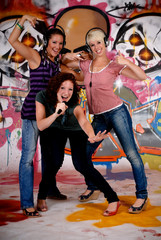 Teen girls graffiti wall