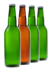 A row of beer bottles with one different from the others