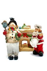 Bonhomme de neige et pere noel devant la cheminée