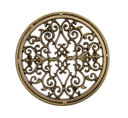 Decorative iron trivet on white