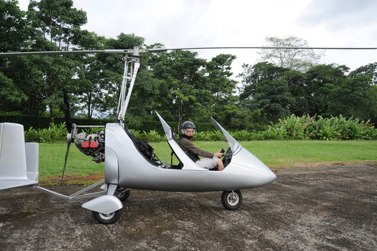 Woman pilot sitting in the autogyro