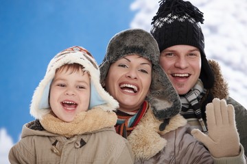 Family in snow at winter