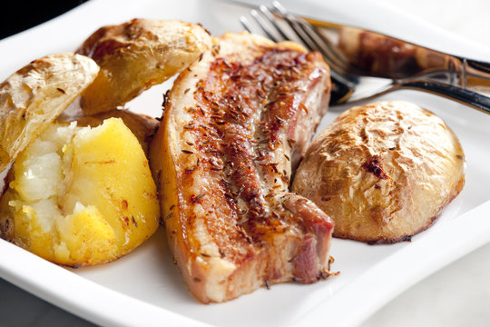 roasted pork meat with potatoes