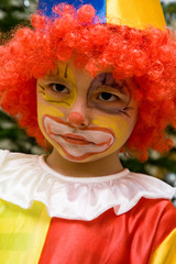 The boy wearing clown