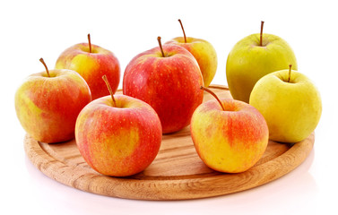 Few apples on wooden tray isolated on white