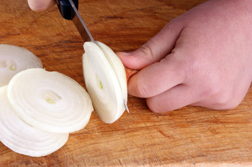 prepare fresh organic onion, hand and knife