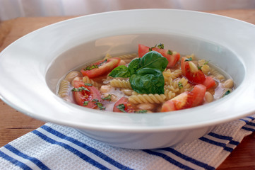 mediterranean noodle soup with white beans and tomato