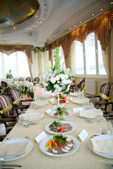 Elegant tables and chairs set up for a wedding banquet