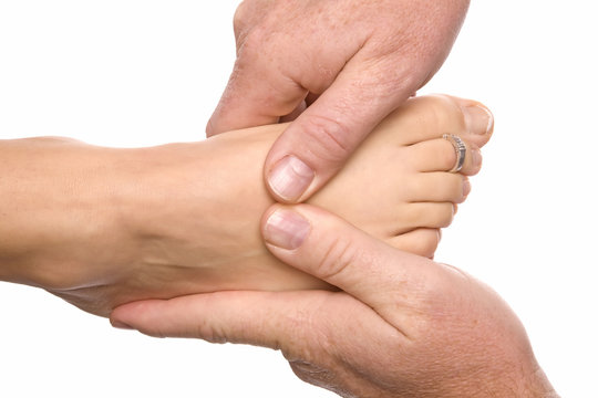 Man massaging womans foot