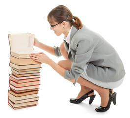 woman and a pile of books
