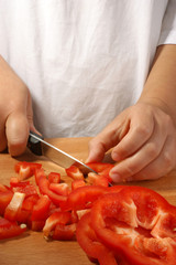 cut one organic paprika, two hands and a knife