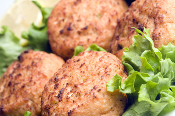lobster cakes with lemon wedges tartar sauce