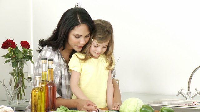 Happy family preparing a meal in the kitchen