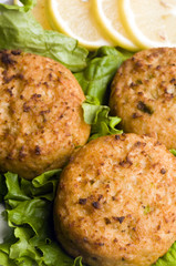 lobster cakes with lemon wedges tartar sauce