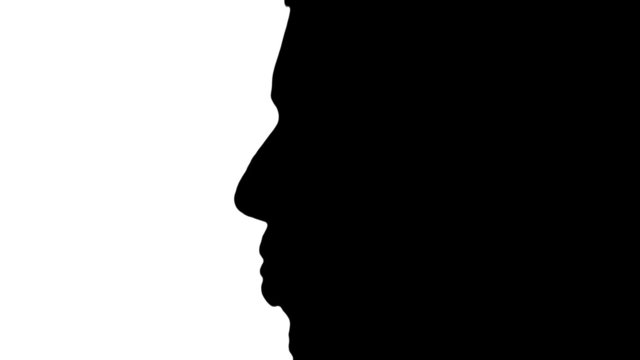 Man sticks tongue out in silhouette - HD