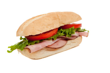 A ham sub sandwich on white