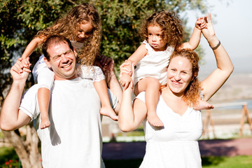 Happy family having fun in the park