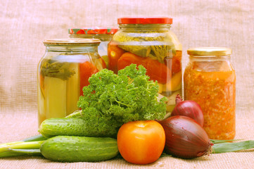 Fresh and tinned vegetables on a sacking