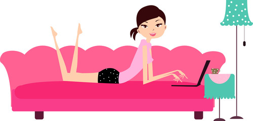 Young girl with laptop relaxing at sofa