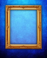 golden frame on blue wall