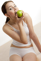 portrait of woman with green apple