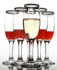 Wineglass with red wine on mirror table