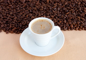 cup with coffee and grain