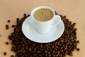 Cup with coffee, costing on coffee grain