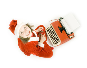 smiling girl typing letter to Santa