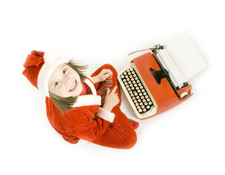 Smiling Girl Typing Letter To Santa